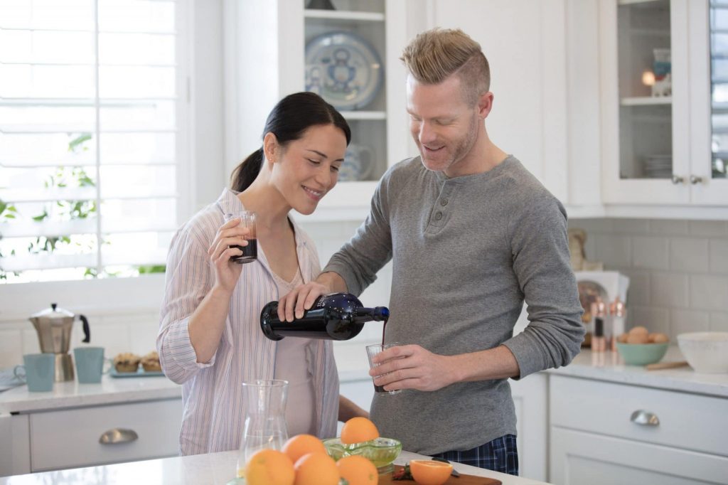 couple drinking from bottle