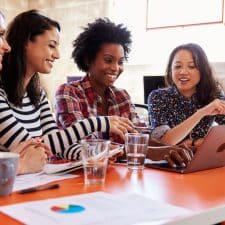 MLM Sales Representatives looking at company website