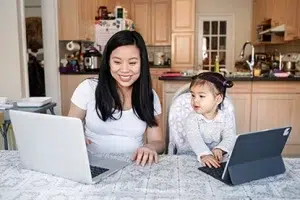 MLM Owner working at home with kids