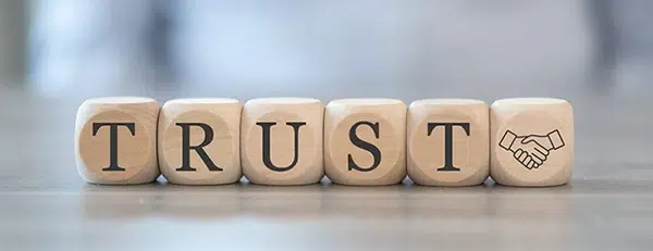 Concept of trust on wooden blocks